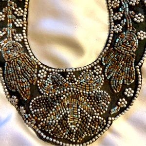 VINTAGE collar with intricate beadwork. Ties in back.